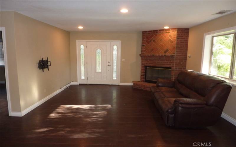 The living room is located just as you walk in the front door, and it has its own fireplace