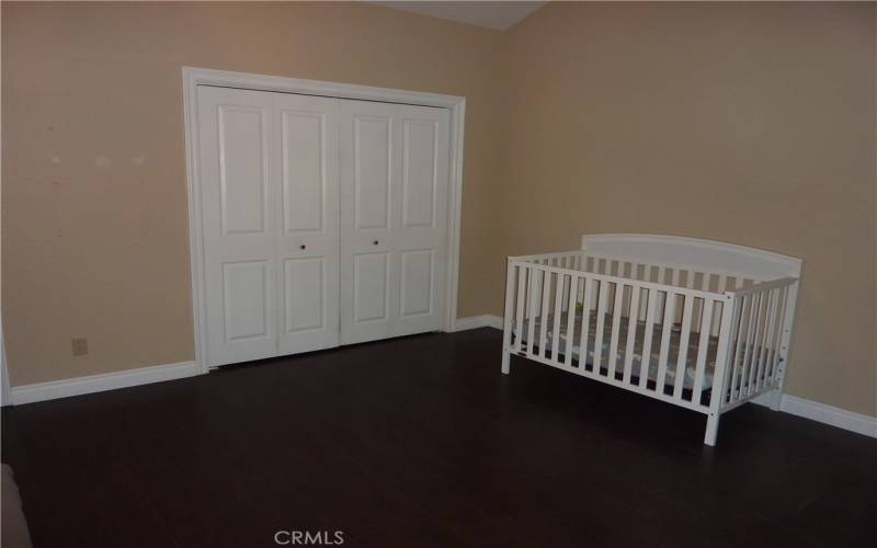 Opposite the master bed area is another open area that would make a great sitting area, or place for a crib