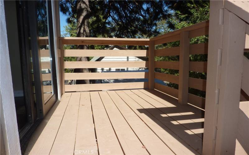 Just off the dining area is a deck that gives you access to the fenced yard in the rear