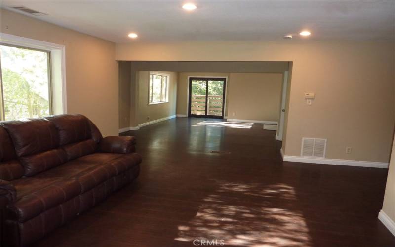 As you walk in the home, you can see the living room, dining area and sliding glass door to the rear deck