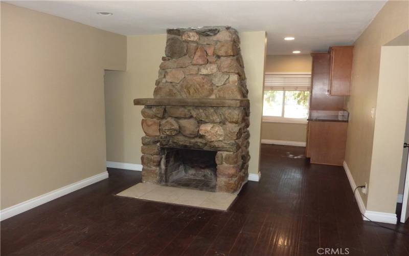 The dining area has its own rock fireplace