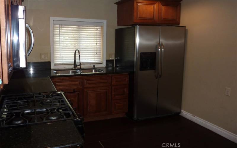 The fully equipped kitchen is located right next to the dining area