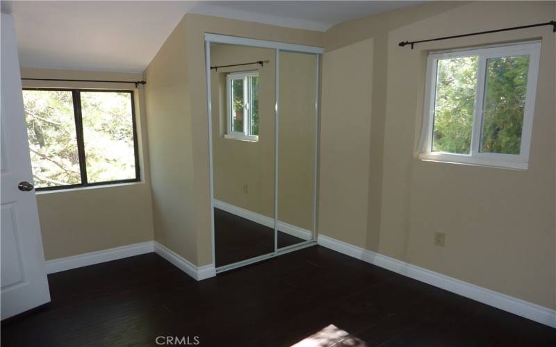 Bedroom #3 on the upper level has a mirrored closet