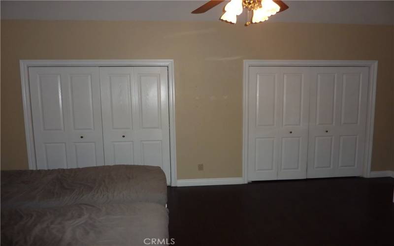 The master bedroom features two large mirrored closets