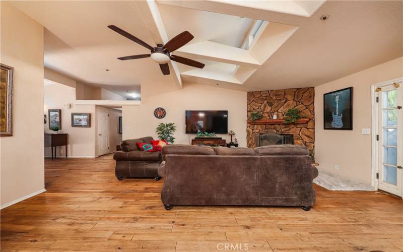 Family room with vaulted ceilings and skylights