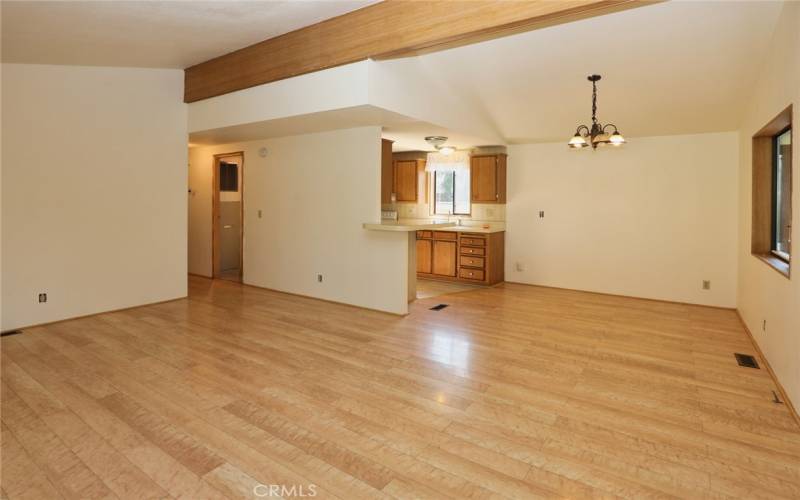 Living room facing dining room and kitchen.