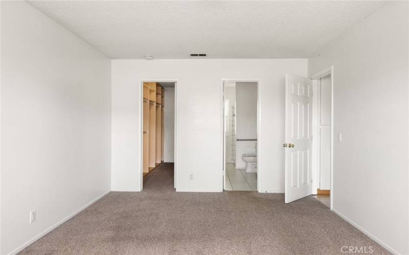 primary bedroom with walk in closet