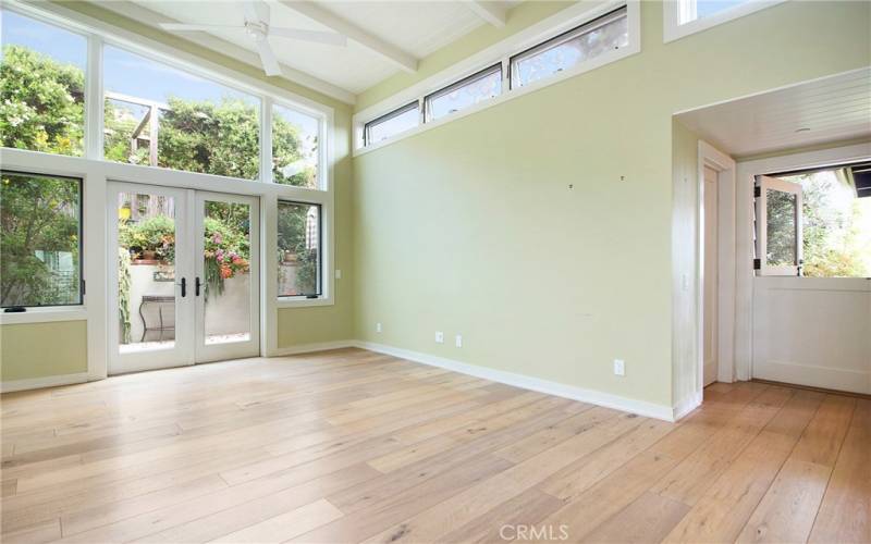 Primary Bedroom with garden view patio and dutch door.