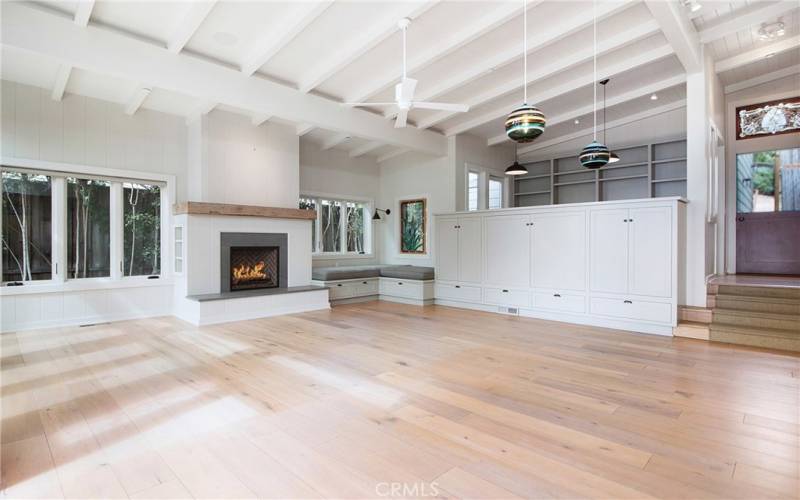 Large Living Room with sit down ocean views, fireplace and looking outside dutch door to entry.