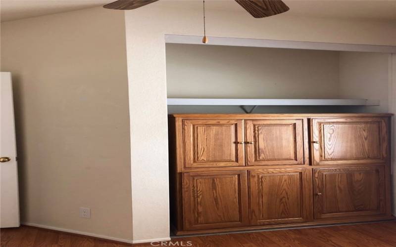 3rd. bedroom closet with office cabinet. Closet doors in the garage