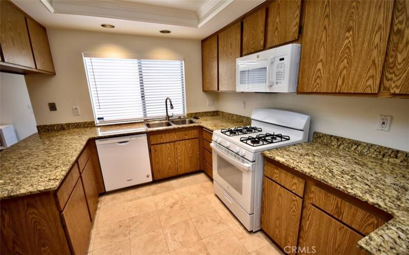 The kitchen is a sleek and functional space, featuring modern appliances, ample storage, and elegant finishes that make cooking a pleasure.