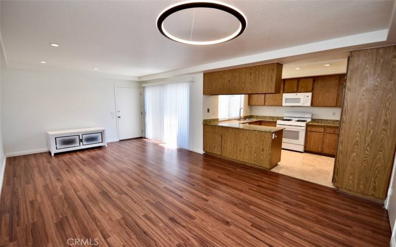 Step into the dining room adorned with rich wood flooring, adding warmth and elegance to the space.