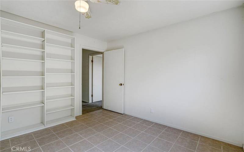 Office or BR#5. Lots of built-in Shelving and Ceiling Fan.