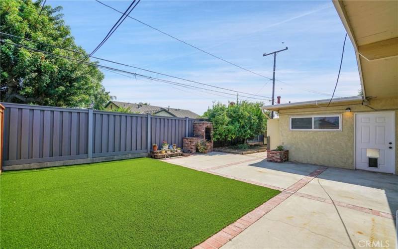 Backyard with newly installed artificial turf.