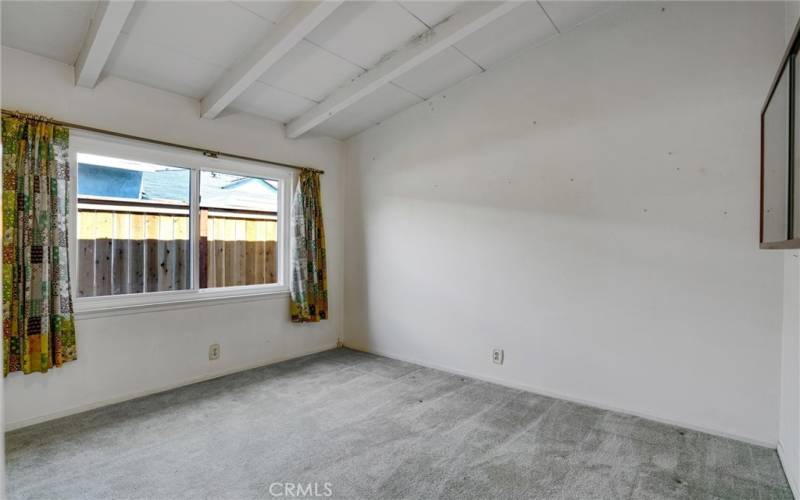 Bedroom #4 with beamed ceiling.