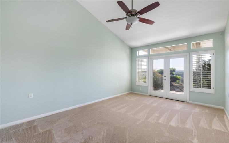 Large Primary Bedroom Towards The Patio Doors.