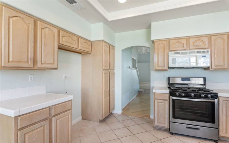 Kitchen w/ View To The Formal Dining & Living Rooms.