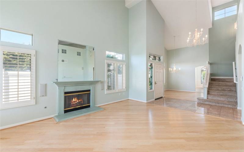 Living Room w/ Fireplace, High Ceilings, Formal Dining & Stairs To The Expansive Loft.