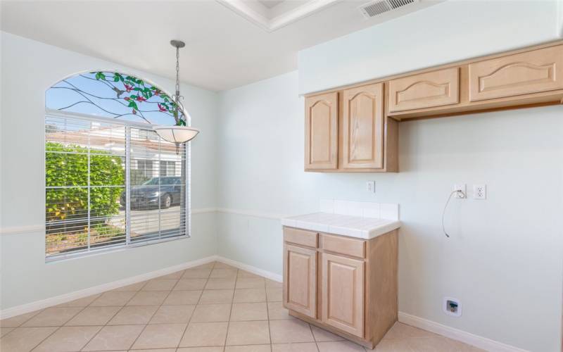 Kitchen Eat-In Area, More Cabinets & Fridge Area.