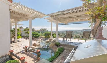 Patio w/ Fantastic Ocean Views To The West. Koi Pond (New Motor), New Built-In BBQ, Stamped Concrete & Raised Shaded Patio Area For Ultimate Sunset Views!