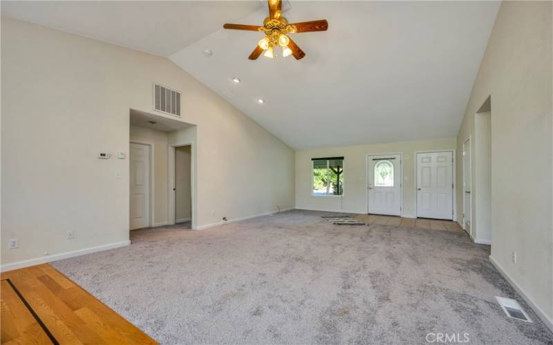 Open living area with vaulted ceiling