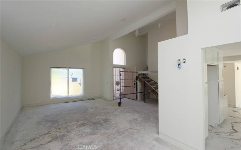 Living room with vaulted ceilings.