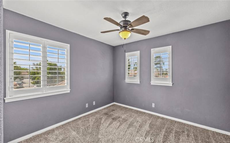 Bedroom Two features a ceiling fan, enhancing the room's comfort and air circulation.