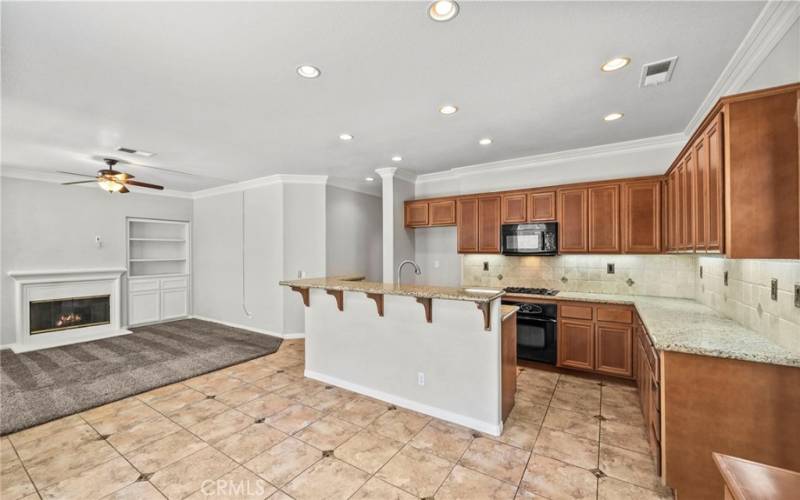 Step into the heart of the home with this expansive kitchen, designed to inspire culinary creativity and effortless entertaining, featuring generous counter space, and abundant cabinetry.