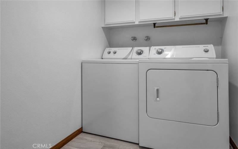 Washer/Dryer in Utility room adjacent to the kitchen