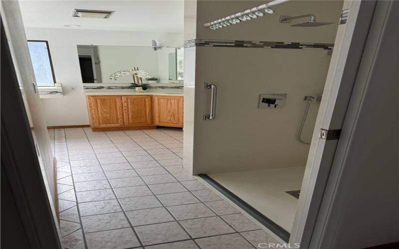 Primary Bathroom with a walk-in shower