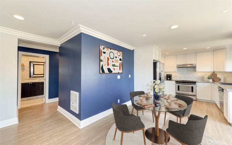 Dining area with recessed lights throughout (virtually staged)