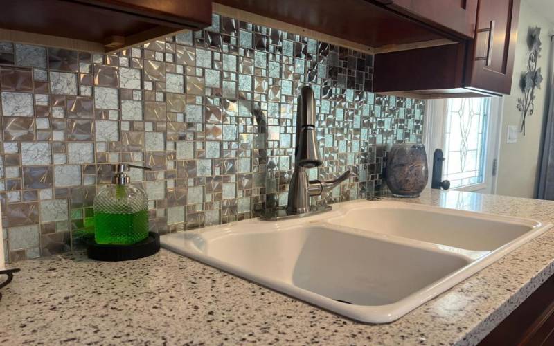 Stone counter tops and designer backsplash.