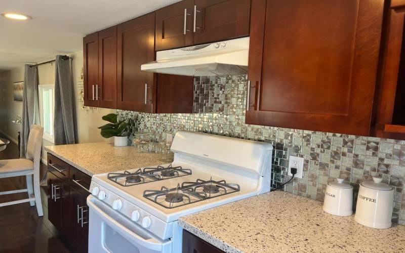 Gas Range with renovated shaker cabinets.