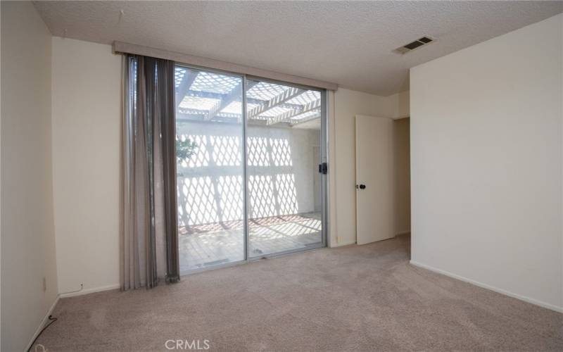 Secondary bedroom with slider to courtyard