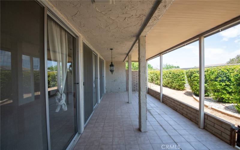 Under roof covered patio at rear