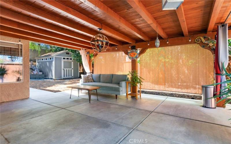 Backyard Patio with Shades and Lighting