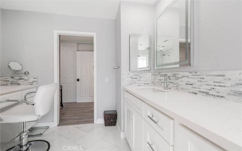 Vanity area in main bathroom with lighted LED mirros and non-fogging technology