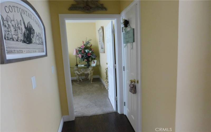 Hallway with 1/2 bath on right side