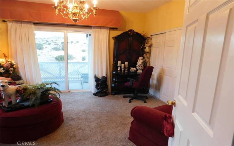 2nd Bedroom with slider glass doors leading to covered patio.