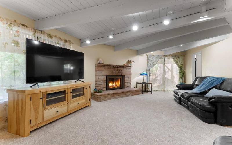 cozy downstairs family room with gas fireplace insert