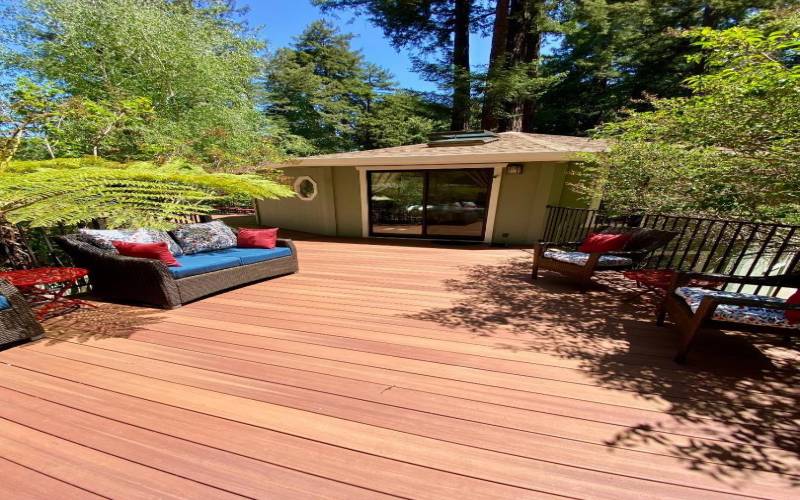 primary bedroom is across the deck from the spa