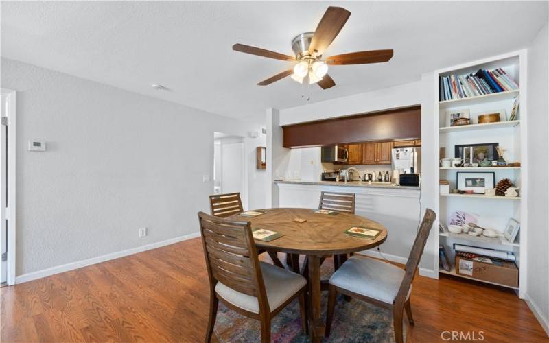 Dining Room looking into kitchen with built in bookshelf