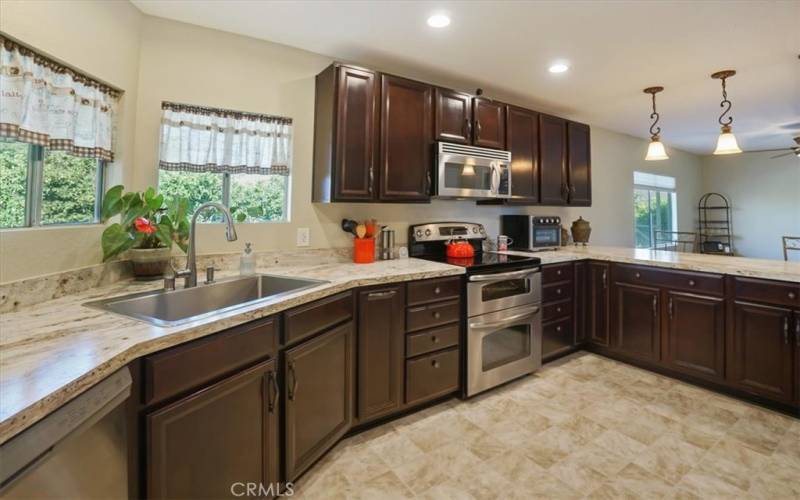 Upgraded sink, Upgraded cabinets, electric stove, built in microwave, Stainless steel appliances