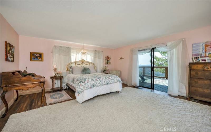 Notice the wonderful deck and views off this large primary bedroom.