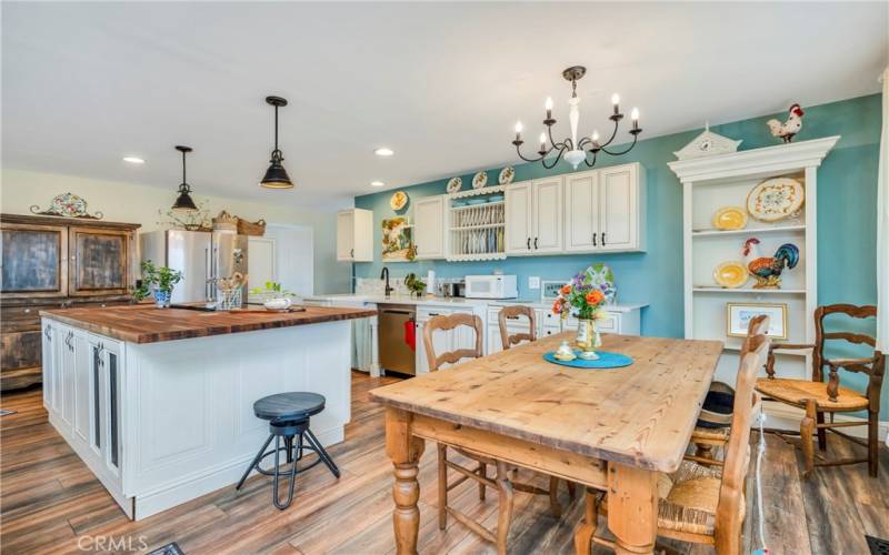 A cheerful country kitchen with space to dine and gather.