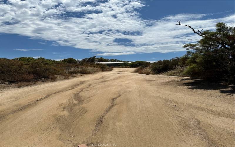 Road to large storage building.