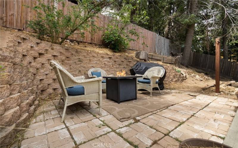 Backyard area to relax with gas fireplace.