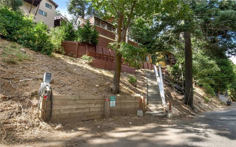 2 dedicated parking spaces out front with EV Charger. Buyer must be comfortable with multiple stairs to get to main entry.