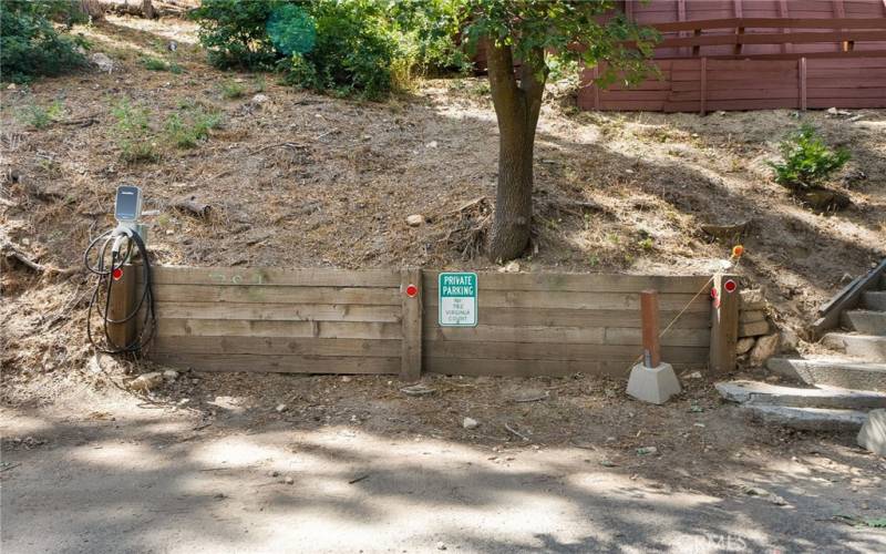 Dedicated level parking area with EV charger.