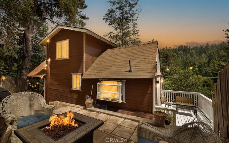 Backyard space with bbq and white refinished wood deck (which is right off the kitchen)